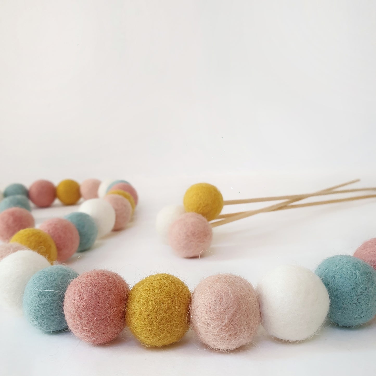 A flatlay of our bloom felt ball garland