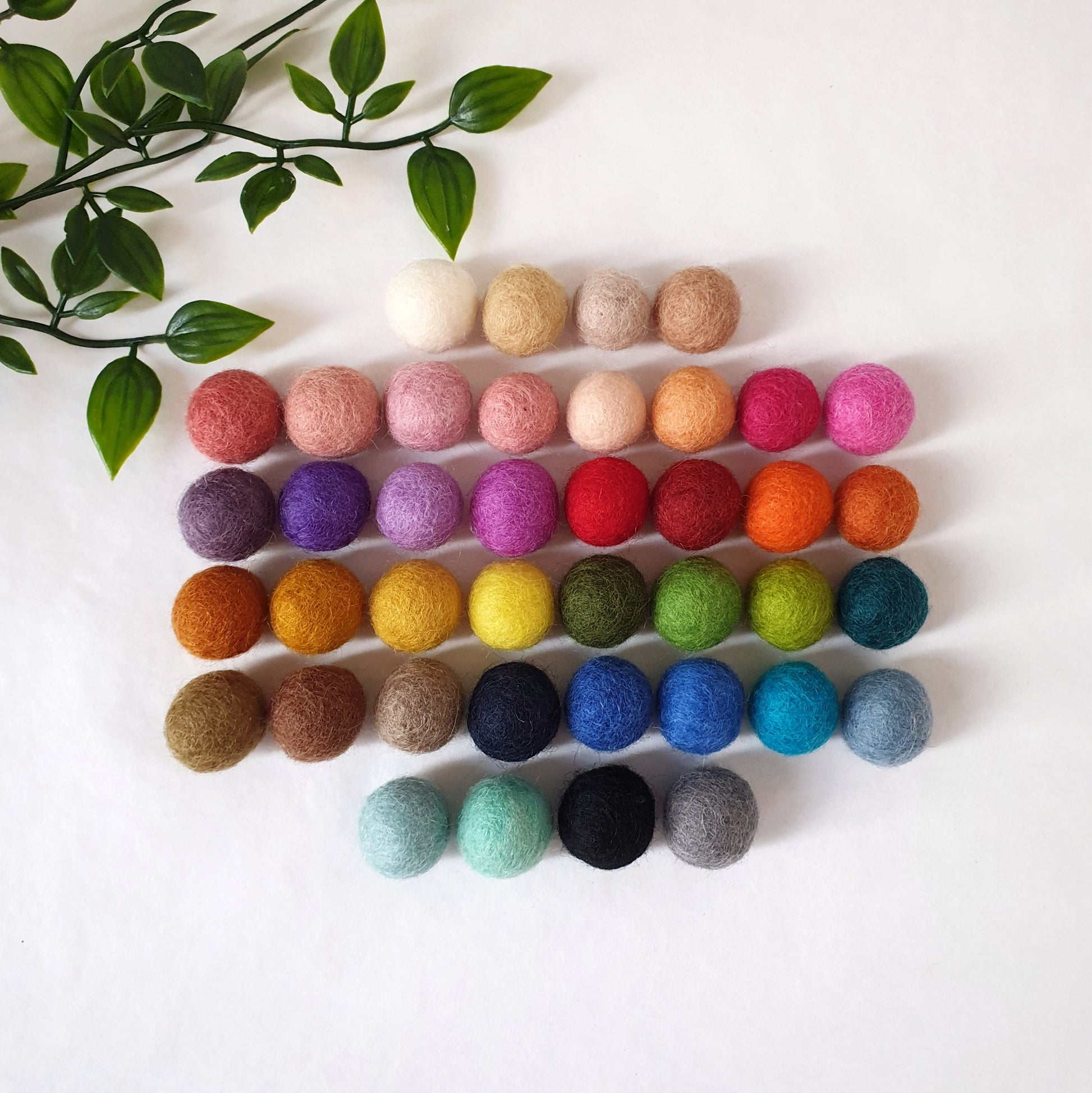 Picture of our colour board showing the range of felt ball colours we offer
